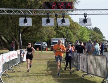 Flying Pirate Half Marathon runners cross the finish line.