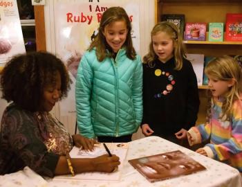 Ruby Bridges with young fans at Island Books in Corolla. Photo Corrine Saunders