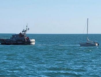 47' Coast Guard Lifeboat tows a damaged sailboat to safety.