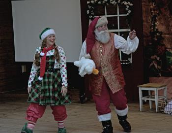 Duck Santa Clause greets children at the Village of Duck Crab Pot Lighting ceremony.