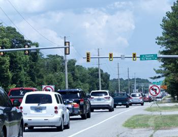 Barriers keep drivers from making left hand turn onto Dogwood Trail.