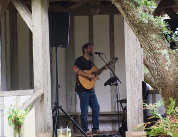 Dustin Furlow performing at the Elizabethan Gardens Gazebo at Sundays at the Overlook. 