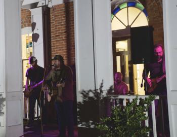 The Brothers Carolina performing on the steps of the Dare Arts building in Manteo.