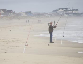 Fishing for sea mullet or whatever grabs the bait on an Outer Banks beach.