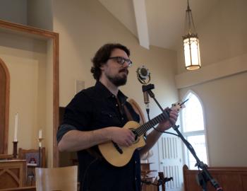 James Hill performing on his ukulele at St. Andrews by the Sea in Nags Head.