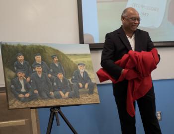 James Melvin unveiling his painting of a Checkerboard Crew.