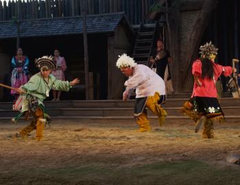 Native American dancers perform a traditional war dance.