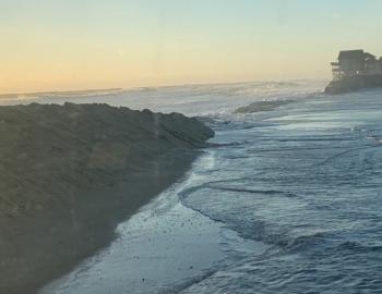  Atlantic Ocean washes over NC12 on January 4.