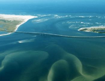 Oregon Inlet with the Marc C. Basnight Bridge.