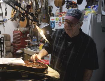 Ronnie Swaim working on a guitar at Jubilee Music.