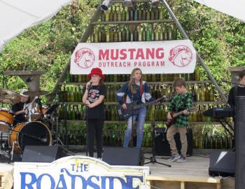 The Runaway Turtles take the stage at the Mustang Outreach Fundraiser.