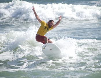 ESA Longboard Surfer catching a wave as summer ends on the Outer Banks.