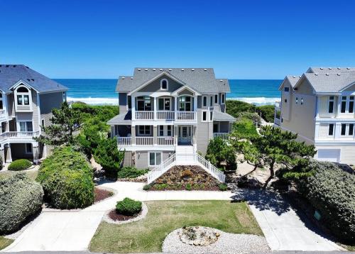 exterior view of outer banks vacation home with ocean in background