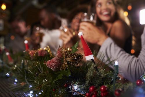 people at a christmas themed bar