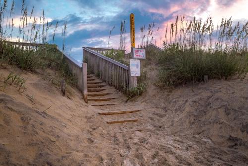 sand covered stairs leading to the beach in Kitty Hawk, NC