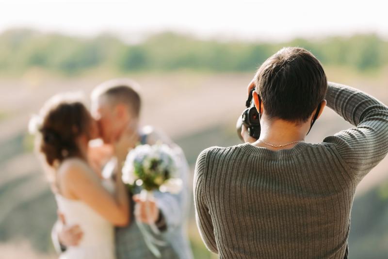 wedding photographer snapping photo of a couple on their special day