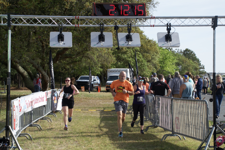 Flying Pirate Half Marathon runners cross the finish line.