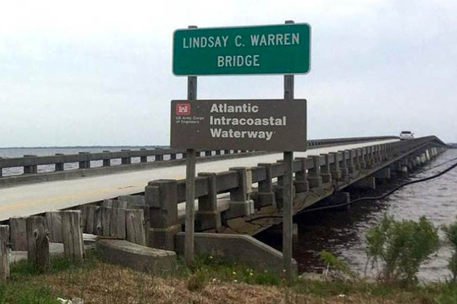 Sign for the Lindsay C. Warren Bridge welcoming travelers the Alligator River Bridge.