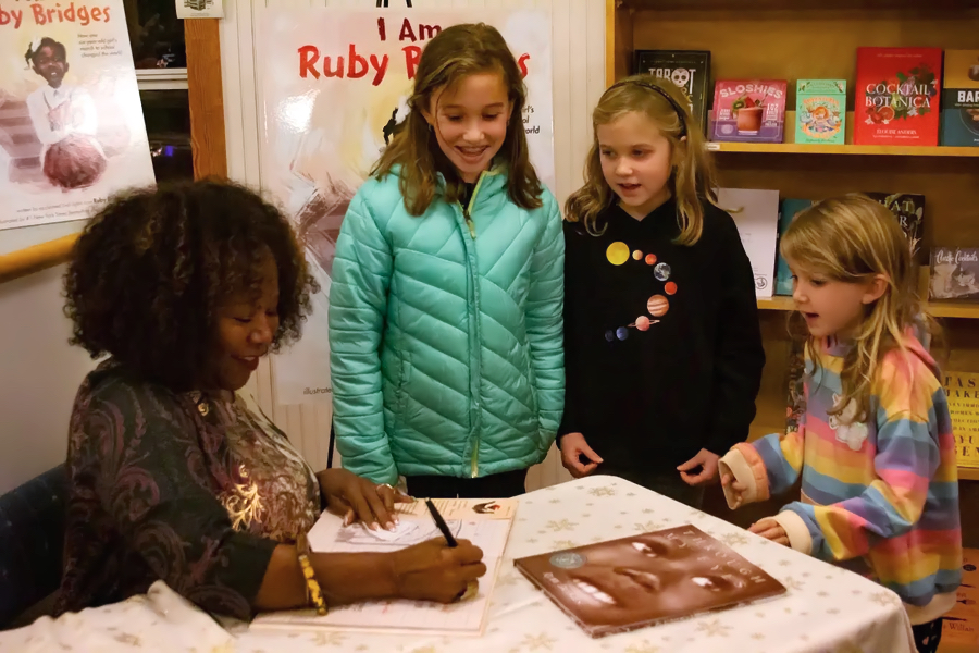 Ruby Bridges with young fans at Island Books in Corolla. Photo Corrine Saunders