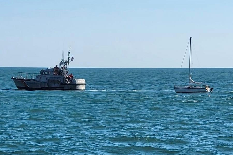 47' Coast Guard Lifeboat tows a damaged sailboat to safety.