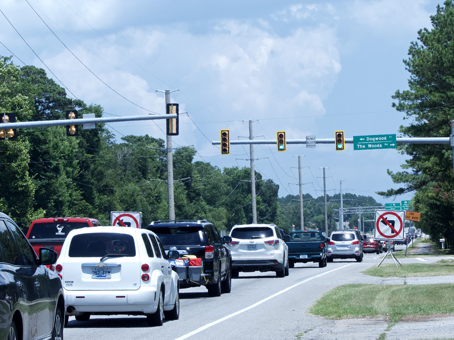 Barriers keep drivers from making left hand turn onto Dogwood Trail.