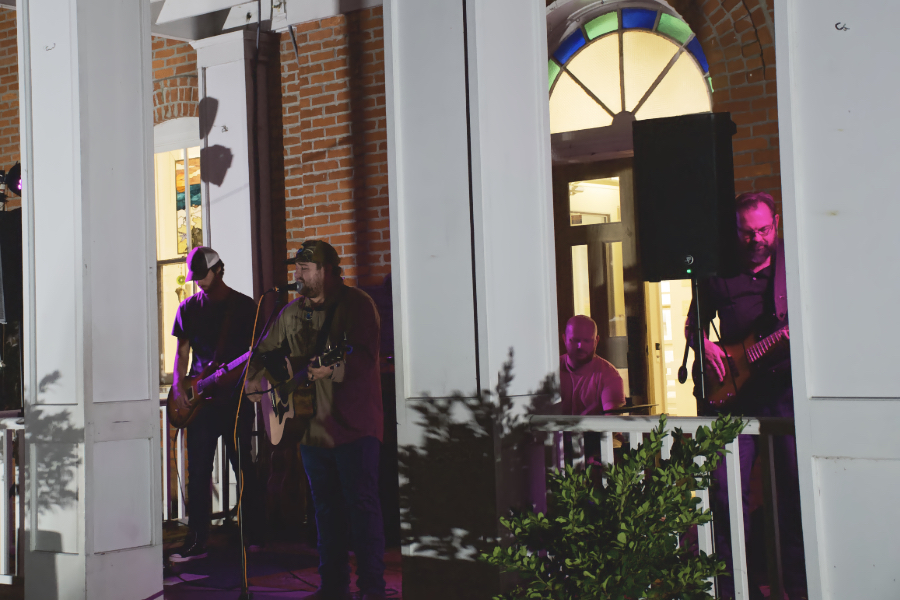 The Brothers Carolina performing on the steps of the Dare Arts building in Manteo.