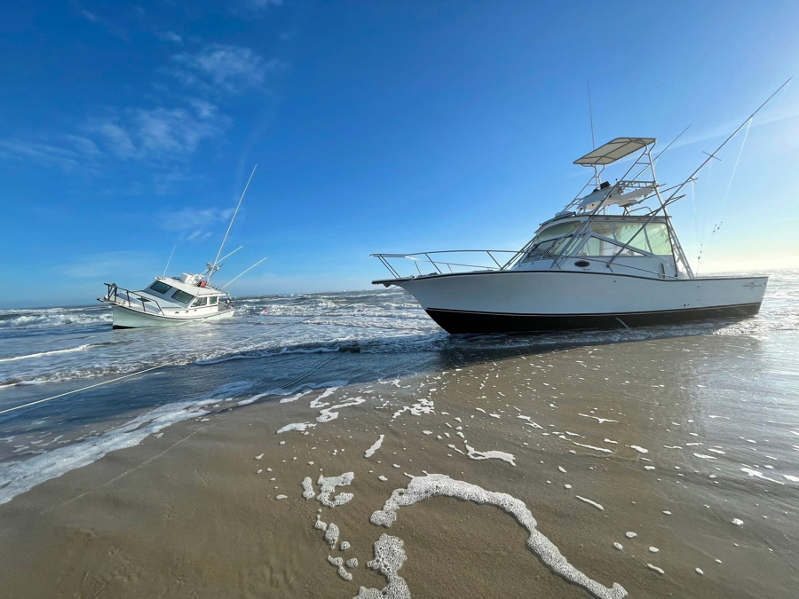 Reel Lucky and Bite Me aground at Oregon Inlet.