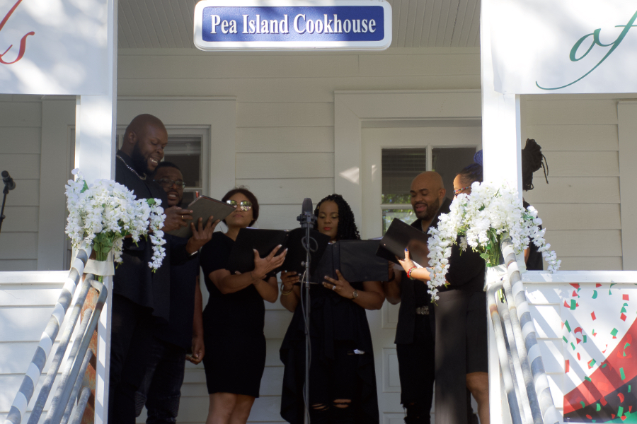 Tshombie Selby celebrates Juneteenth with Members of ECSU chorus at the Pea Island Cookhouse Museum.
