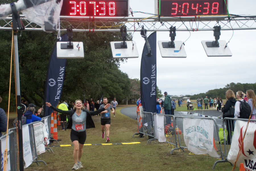 The joy of crossing the half marathon finish line at the Outer Banks Half Marathon.