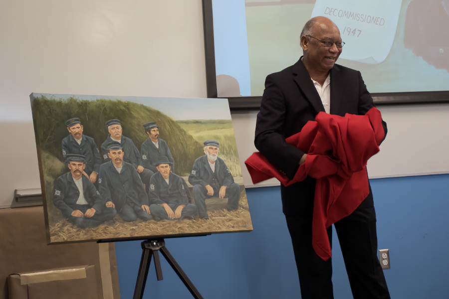 James Melvin unveiling his painting of a Checkerboard Crew.