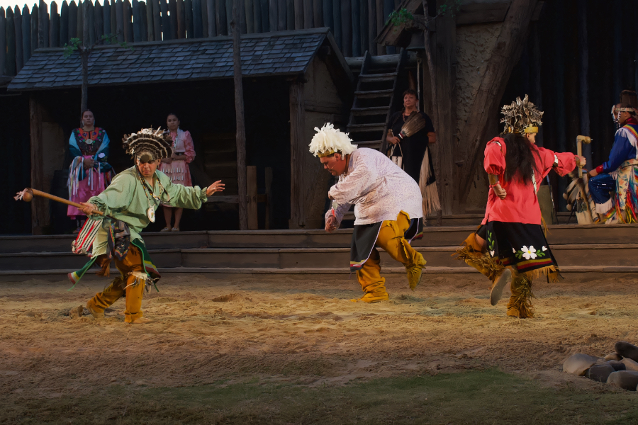 Native American dancers perform a traditional war dance.