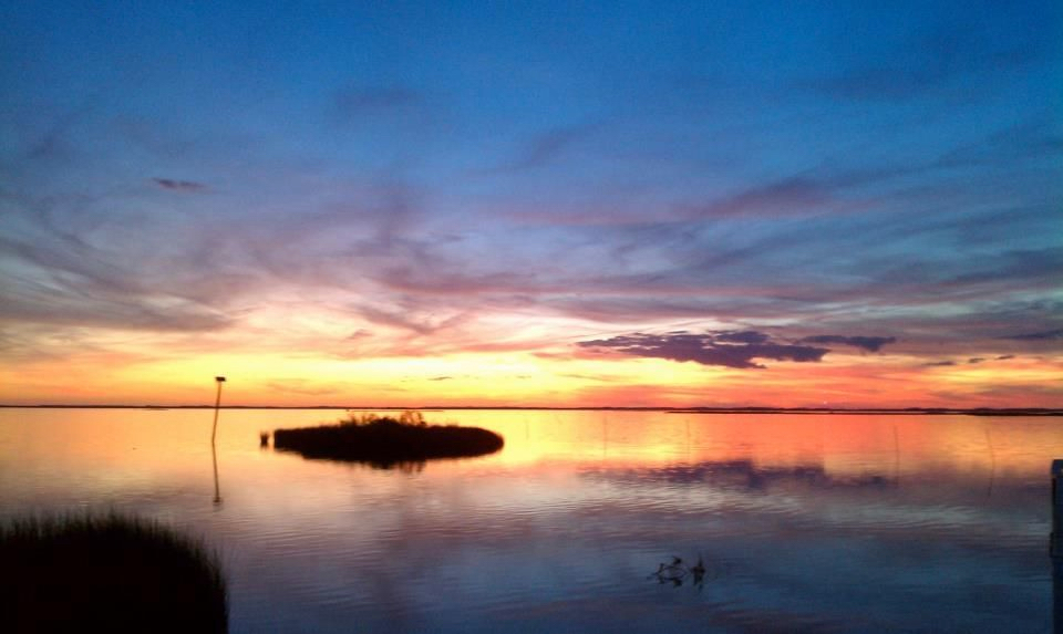 Spectacular sunsets are just one of the reasons to dine at the Paper Canoe in Duck.