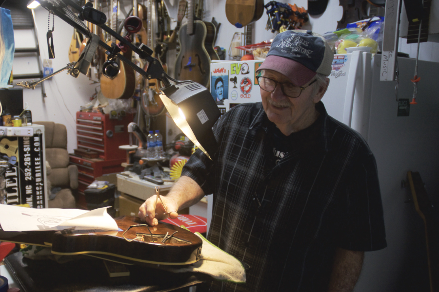 Ronnie Swaim working on a guitar at Jubilee Music.