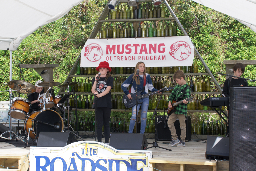 The Runaway Turtles take the stage at the Mustang Outreach Fundraiser.