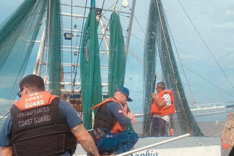 Coast Guard watercraft approaches shrimp boat Miss Sohpia for rescue.