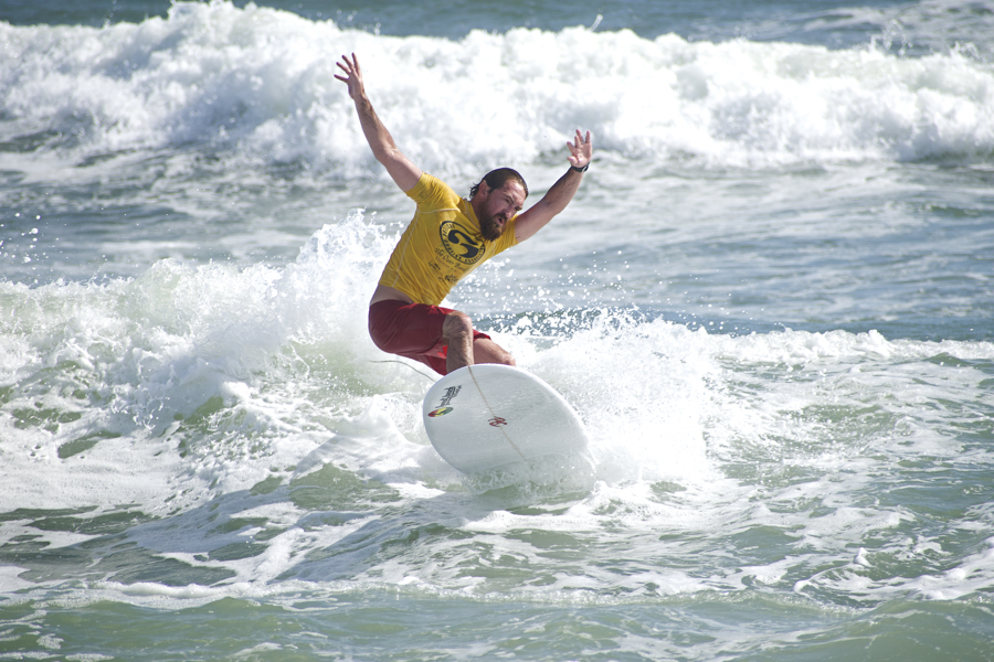 ESA Longboard Surfer catching a wave as summer ends on the Outer Banks.