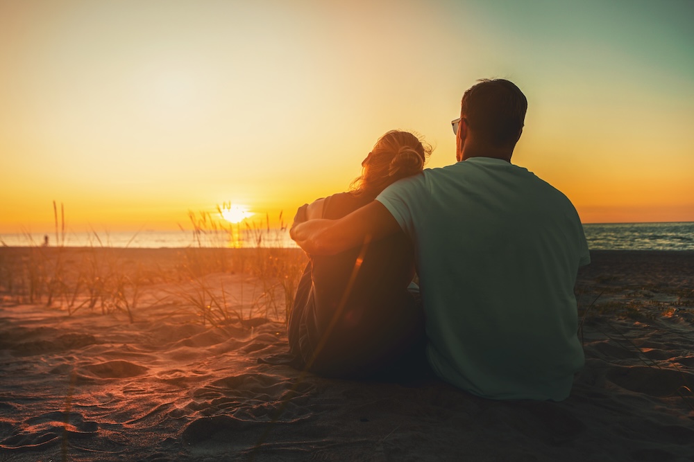 couple on beach at sunset