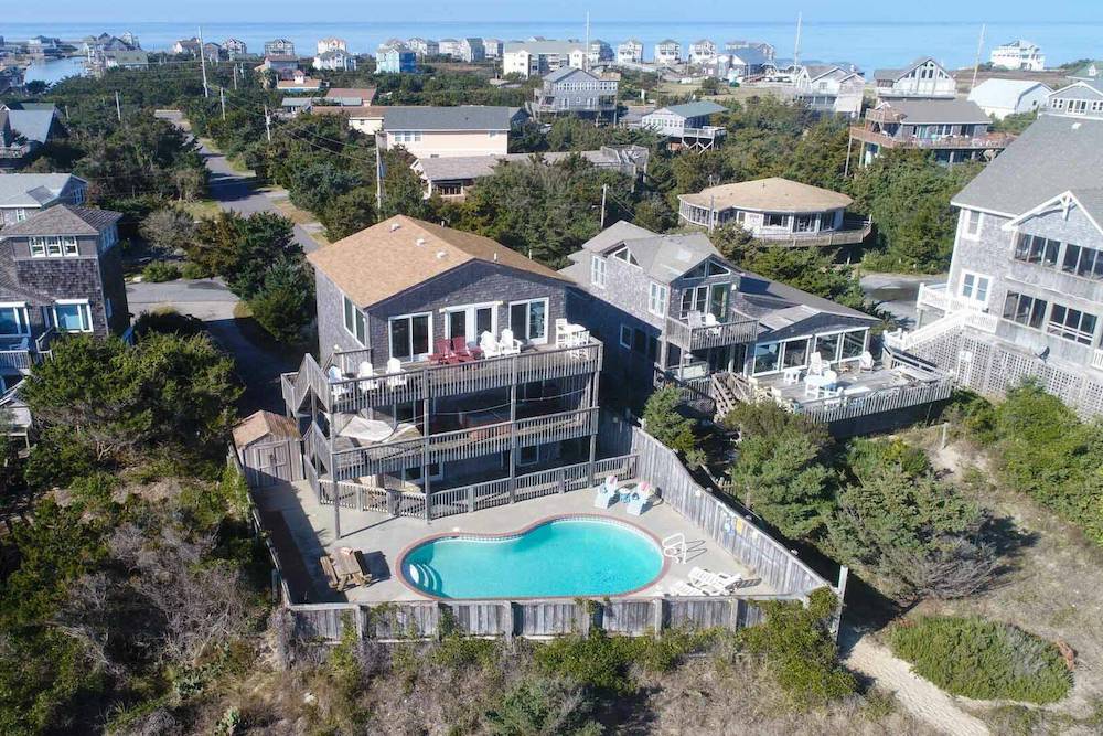 aerial view of beachfront home in outer banks showing pool and beach access walkway
