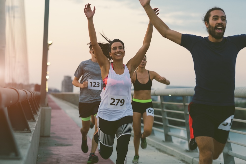 runners in a race crossing a bridge